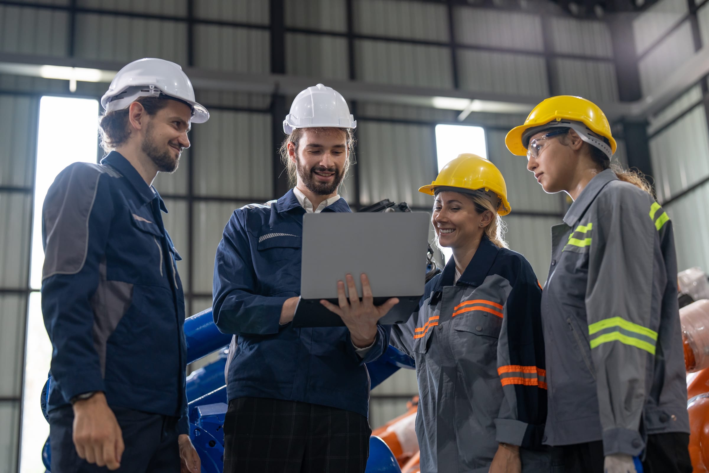 Bismark coaches working with operations team on the factory floor
